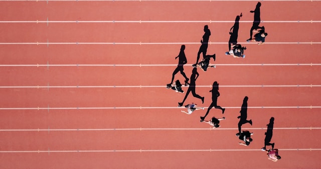 Overhead photo of runners on a track