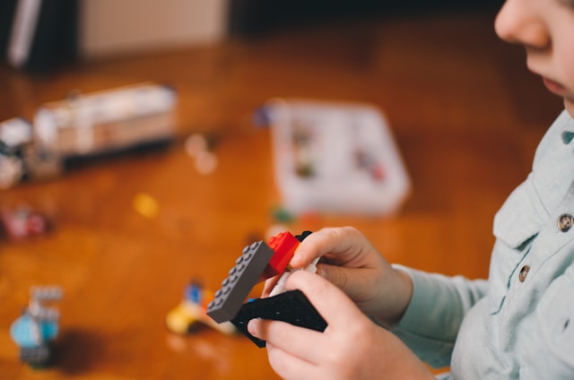 Photo of child playing with building blocks