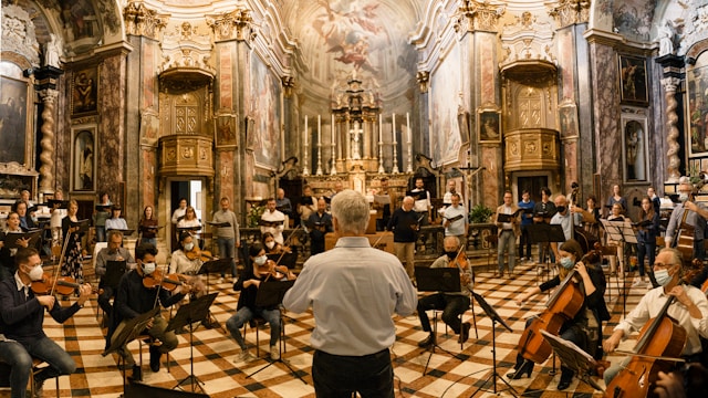 Photo of conductor conducting an and orchestra