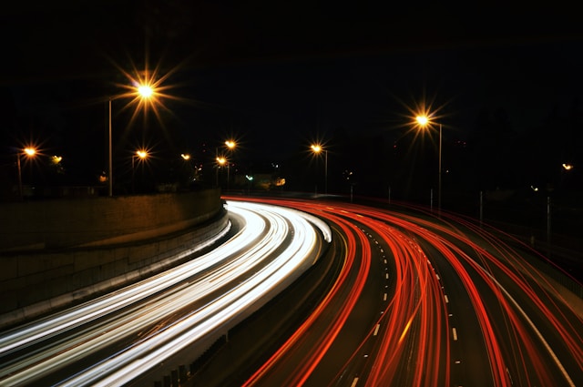 Long exposure of many cars on highway at night